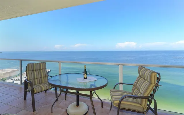 a view of balcony with furniture