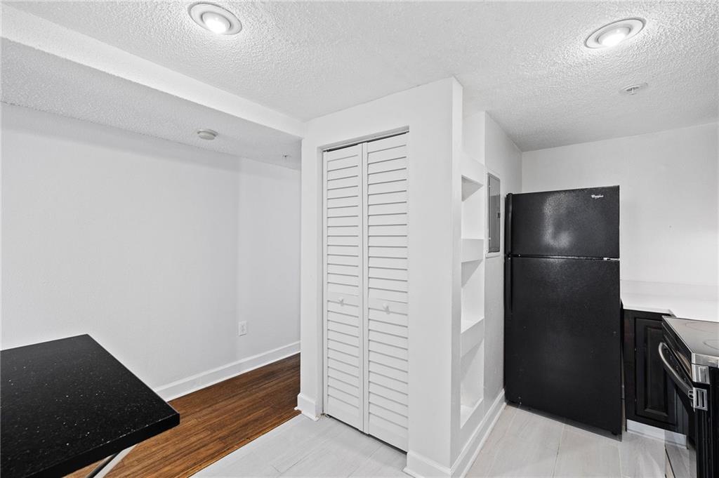 383 Ralph McGill Boulevard Northeast, Unit J Atlanta, GA 30312 - Photo 12 of 33 a view of walk in closet with wooden floor