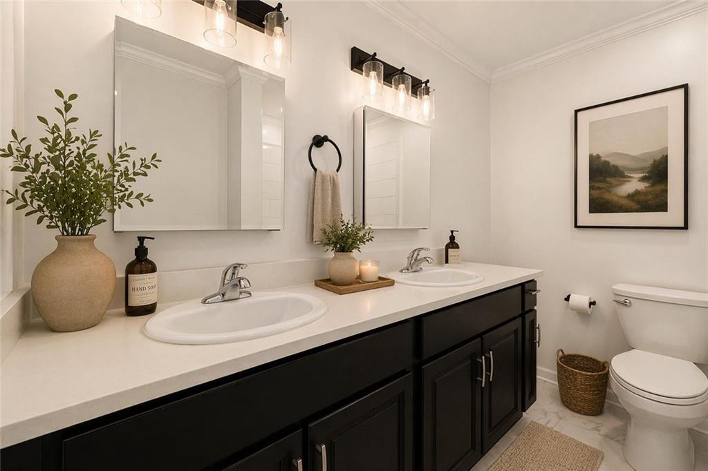 383 Ralph McGill Boulevard Northeast, Unit J Atlanta, GA 30312 - Photo 19 of 33 a bathroom with a double vanity sink and a mirror