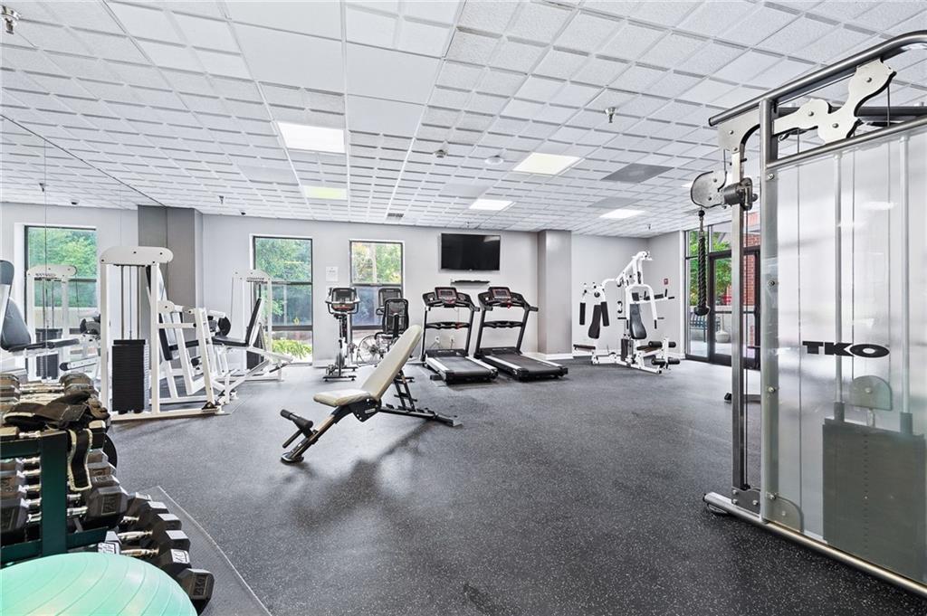 383 Ralph McGill Boulevard Northeast, Unit J Atlanta, GA 30312 - Photo 22 of 28 a view of a room with gym equipment
