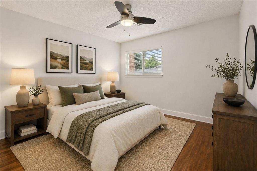 383 Ralph McGill Boulevard Northeast, Unit J Atlanta, GA 30312 - Photo 22 of 33 a bedroom with bed and a window