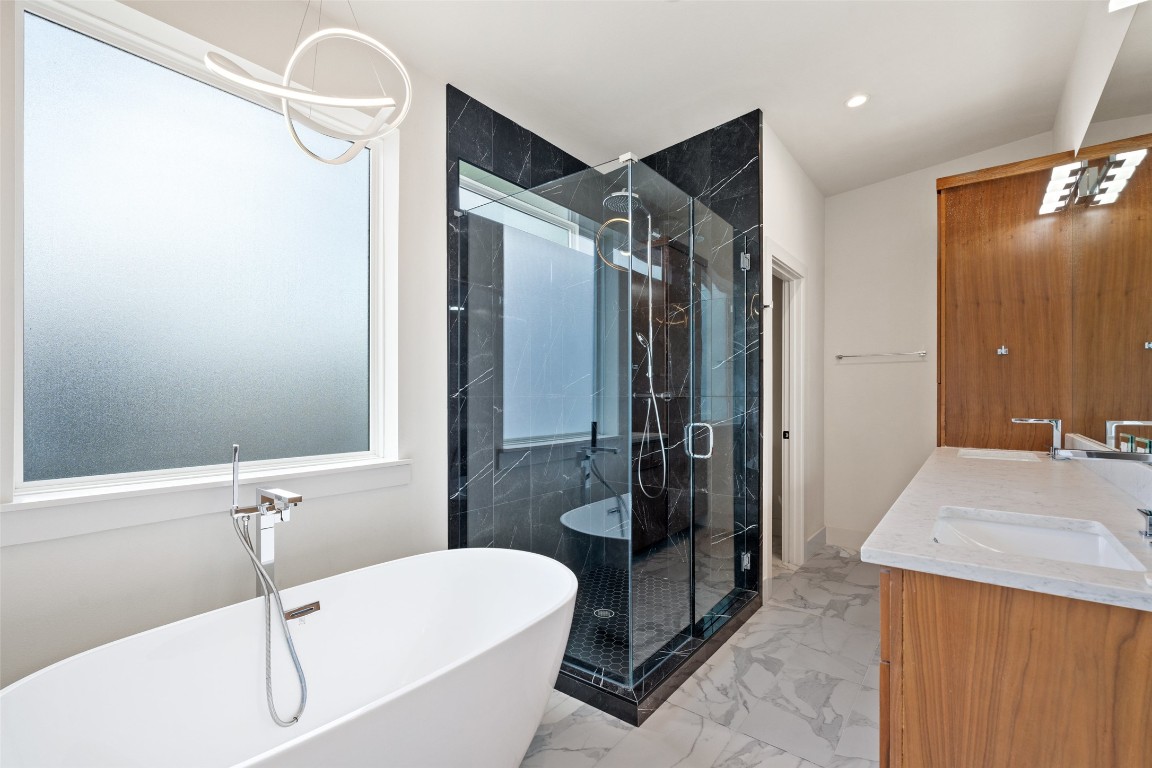 108 Tillery Street, Unit 1 Austin, TX 78702 - Photo 15 of 26 a bathroom with a granite countertop sink a toilet and shower