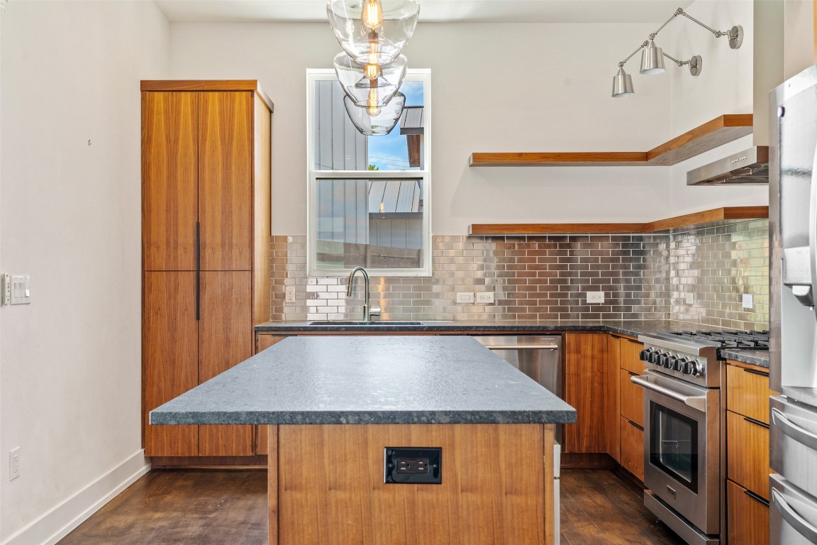 108 Tillery Street, Unit 1 Austin, TX 78702 - Photo 5 of 26 a kitchen with a stove a sink and cabinets