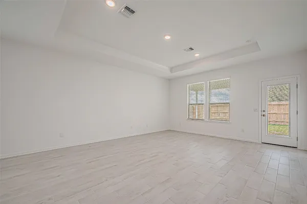 a view of a patio with table and chairs and potted plants
