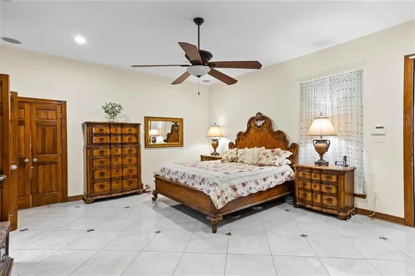 a bedroom with a bed and dresser