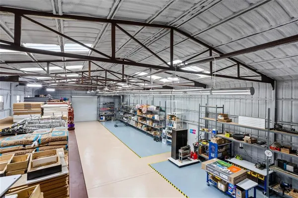 an aerial view of a residential houses with outdoor space and swimming pool