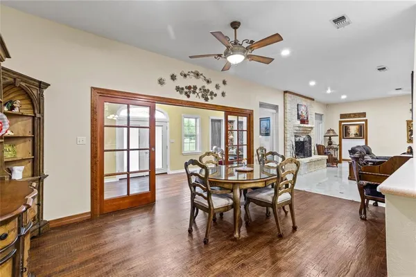 a view of a dining room with furniture window and wooden floor