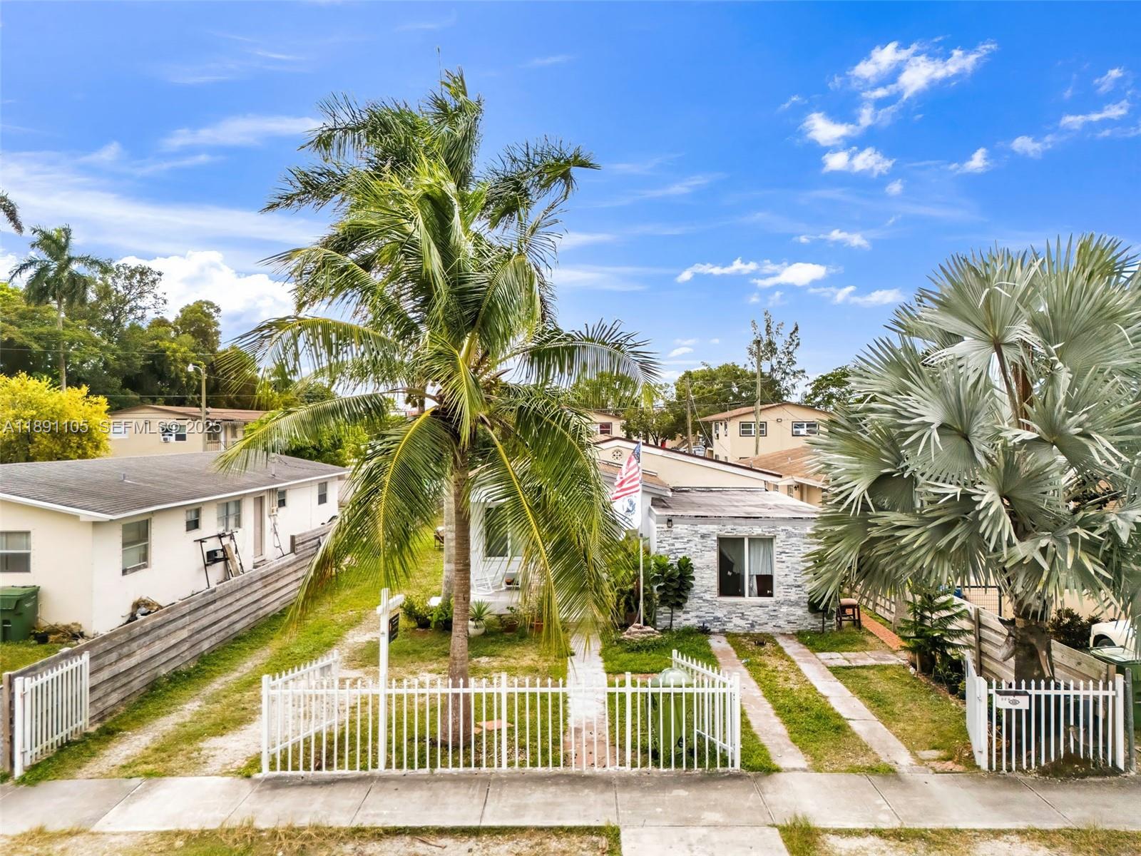 110 Northeast 9th Court Homestead, FL 33030 - Photo 6 of 26 a view of a house with a swimming pool