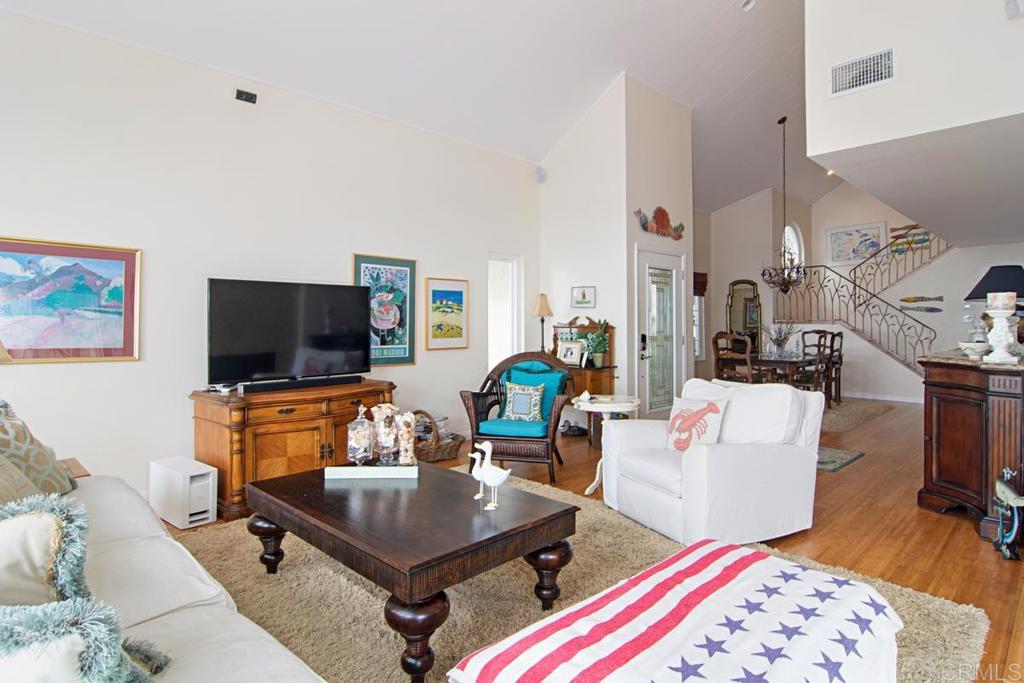67 Tunapuna Lane Coronado, CA 92118 - Photo 4 of 13 a living room with furniture and a flat screen tv