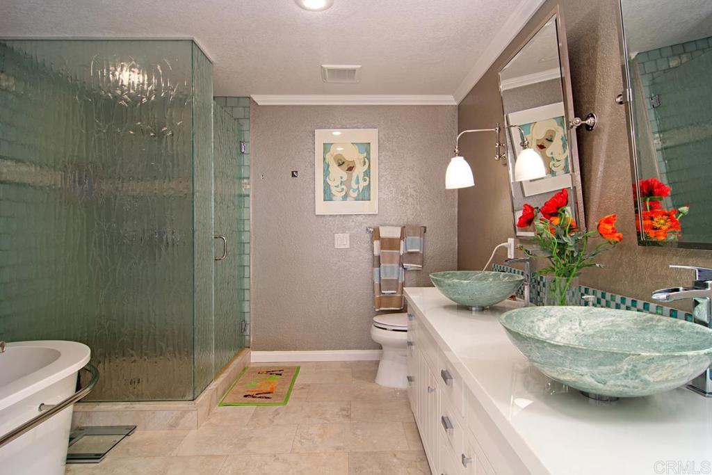 67 Tunapuna Lane Coronado, CA 92118 - Photo 9 of 13 a view of bathroom with a toilet sink and mirror