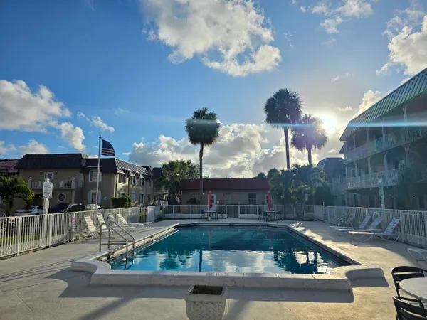 a view of a swimming pool with a patio