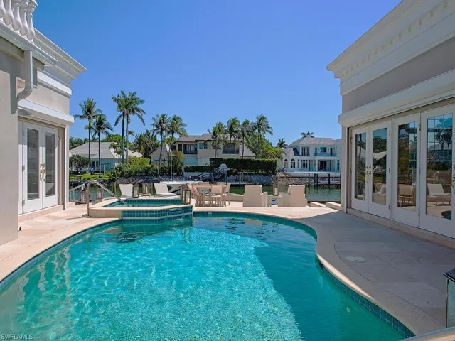 a view of a backyard with sitting area