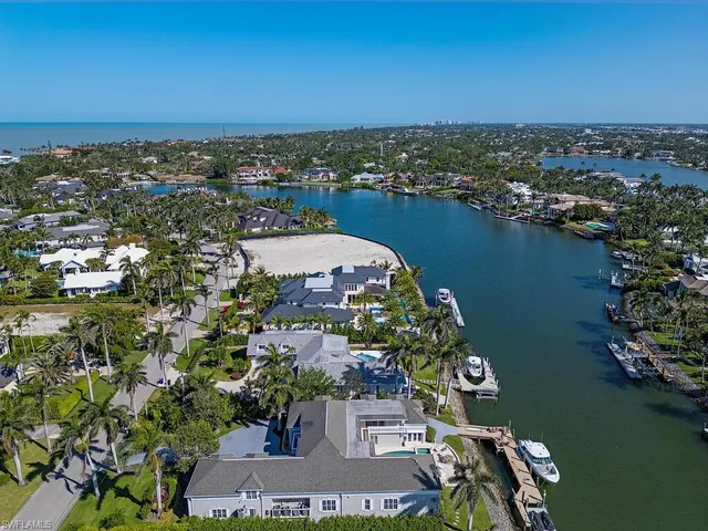 an aerial view of a house with a lake view