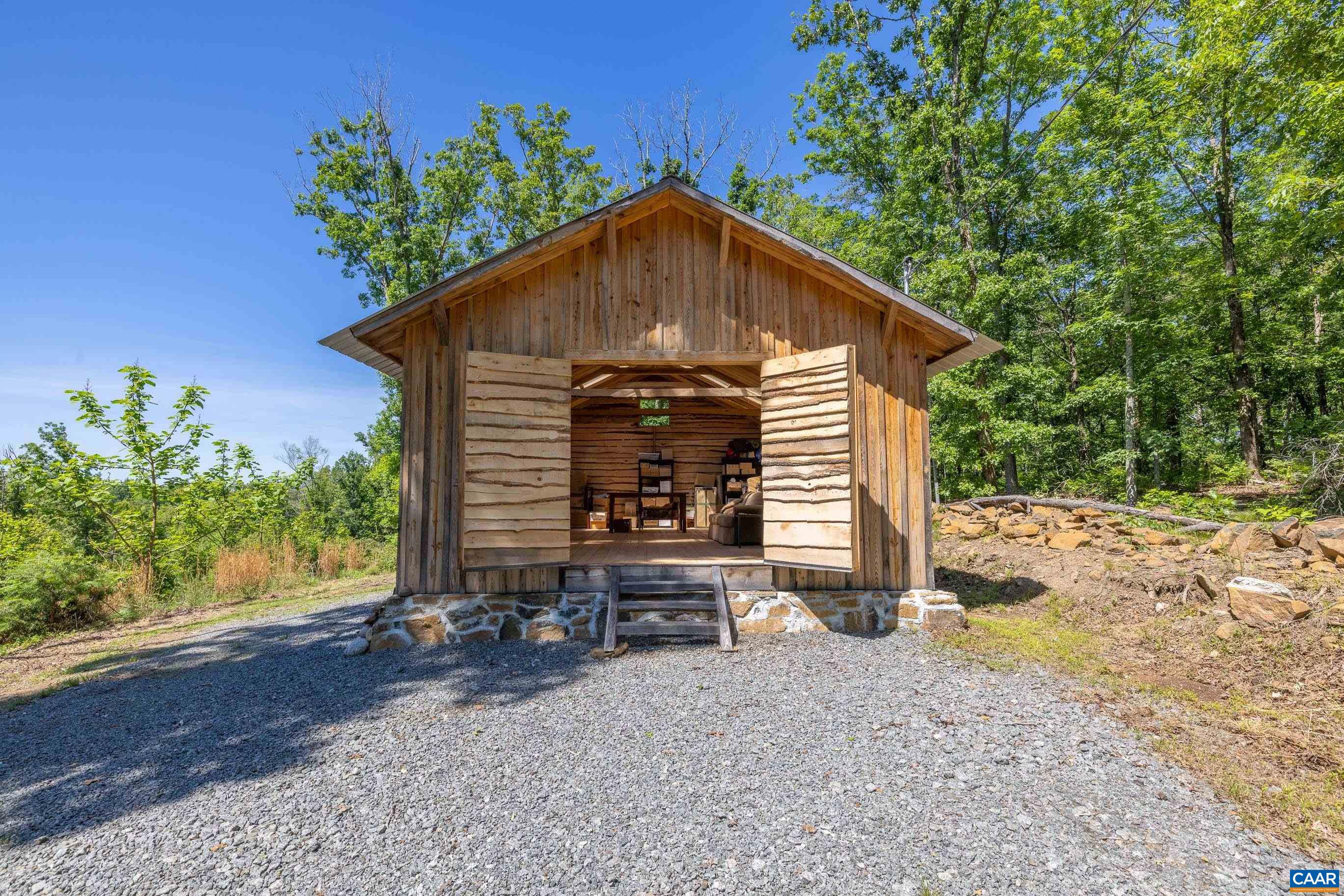 7676 Old Dominion Road Schuyler, VA 22969 - Photo 5 of 29 a front view of a house with a yard