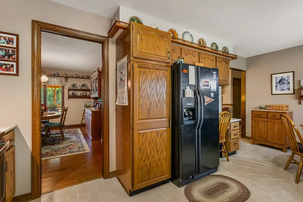 a kitchen with stainless steel appliances granite countertop a sink a stove and a refrigerator