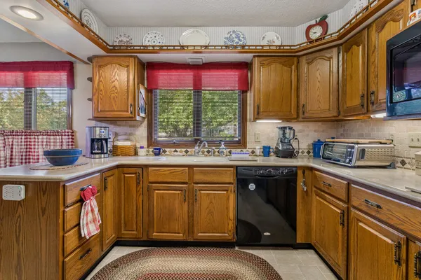 a view of a dining room with furniture and window