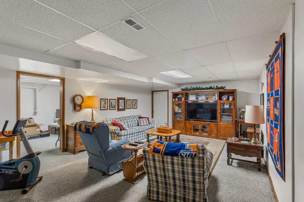 a bathroom with a shower curtain and sink