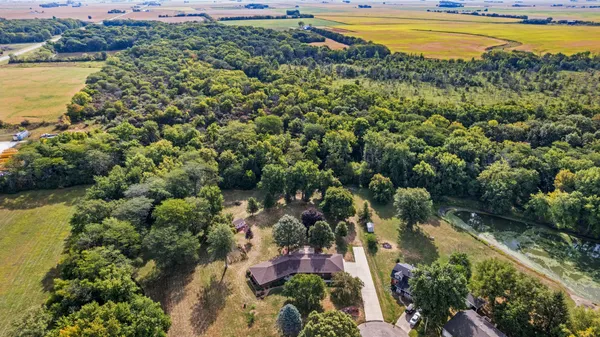 an aerial view of a house with a yard