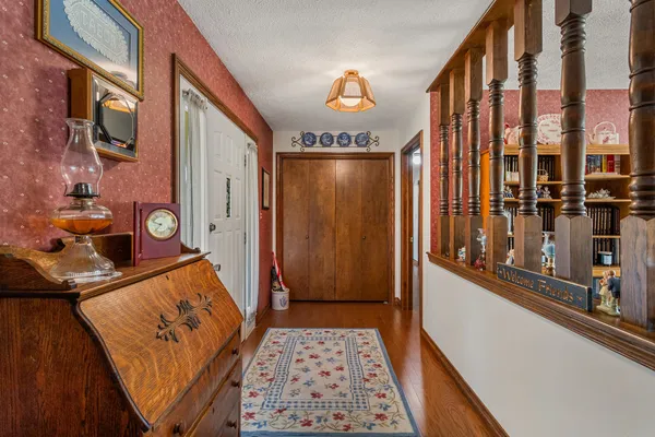 a reading room with furniture and a book shelf