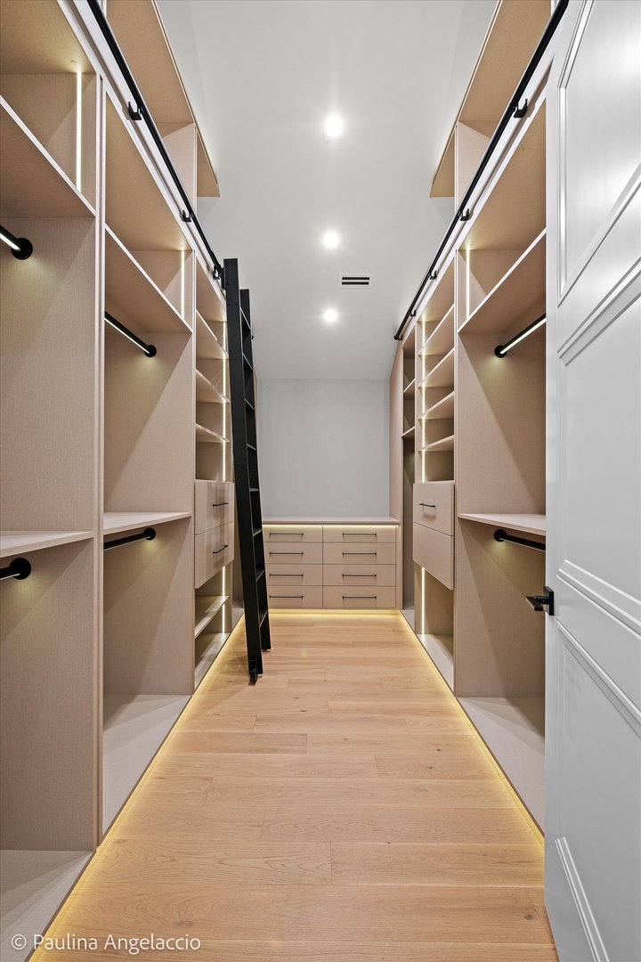 699 Plum Tree Road Barrington Hills, IL 60010 - Photo 43 of 84 a view of walk in closet with empty racks