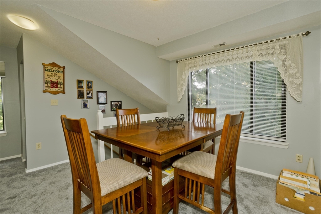 65 Nassau Drive, Unit 65 Springfield, MA 01129 - Photo 12 of 32 a dining room with furniture and window