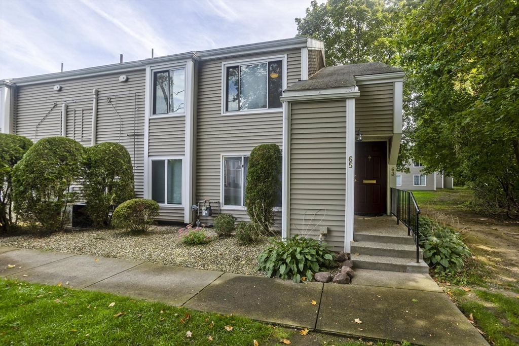 65 Nassau Drive, Unit 65 Springfield, MA 01129 - Photo 2 of 32 a front view of a house with garden