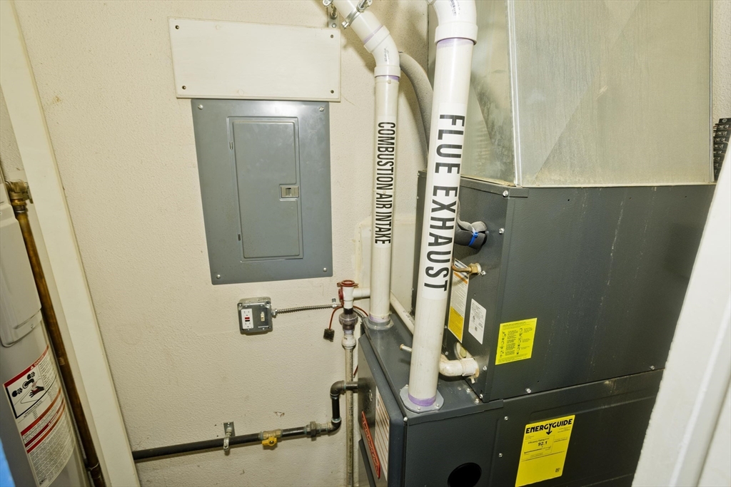 65 Nassau Drive, Unit 65 Springfield, MA 01129 - Photo 24 of 32 a bathroom with a sink and mirror