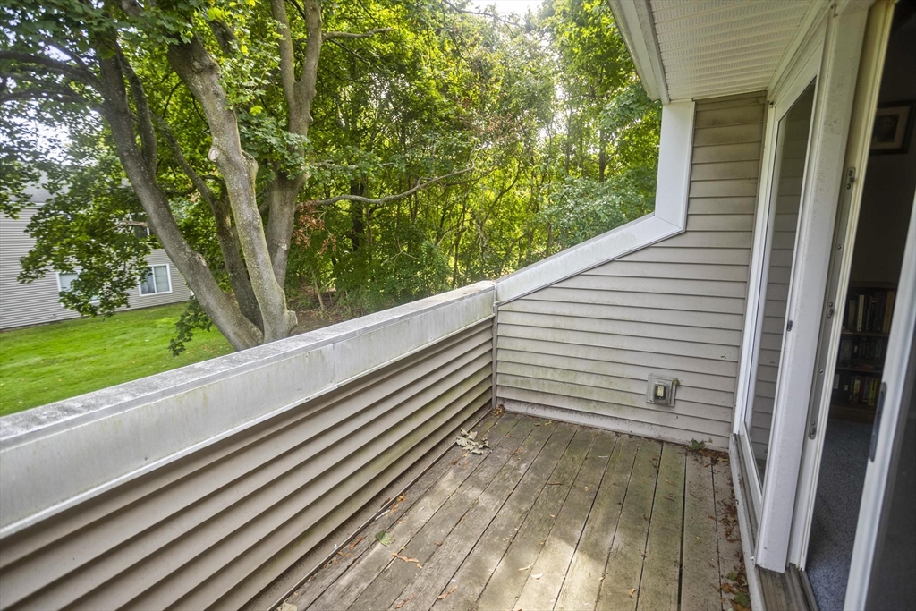 65 Nassau Drive, Unit 65 Springfield, MA 01129 - Photo 5 of 32 a view of a balcony with an outdoor space