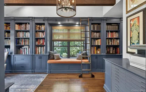 a reading room with furniture and window