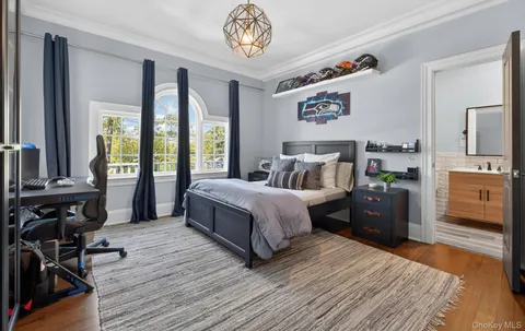 a bedroom with a bed and a view of bedroom