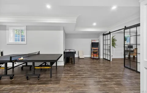 a view of a work space with furniture and wooden floor