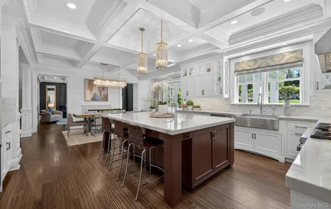 a kitchen with center island and stainless steel appliances