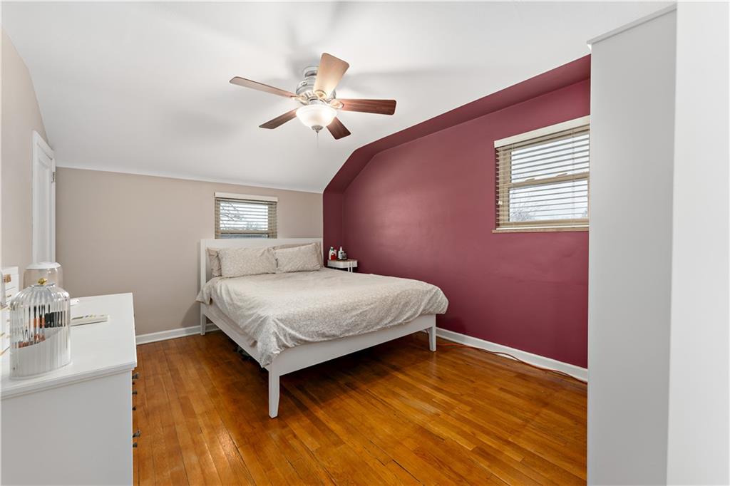 133 Cambridge Road Bethel Park, PA 15102 - Photo 18 of 43 a bedroom with a bed and a chandelier