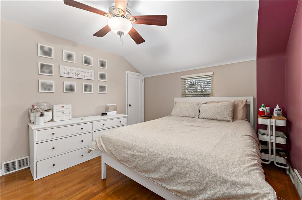 133 Cambridge Road Bethel Park, PA 15102 - Photo 19 of 43 a bedroom with a bed and a chandelier