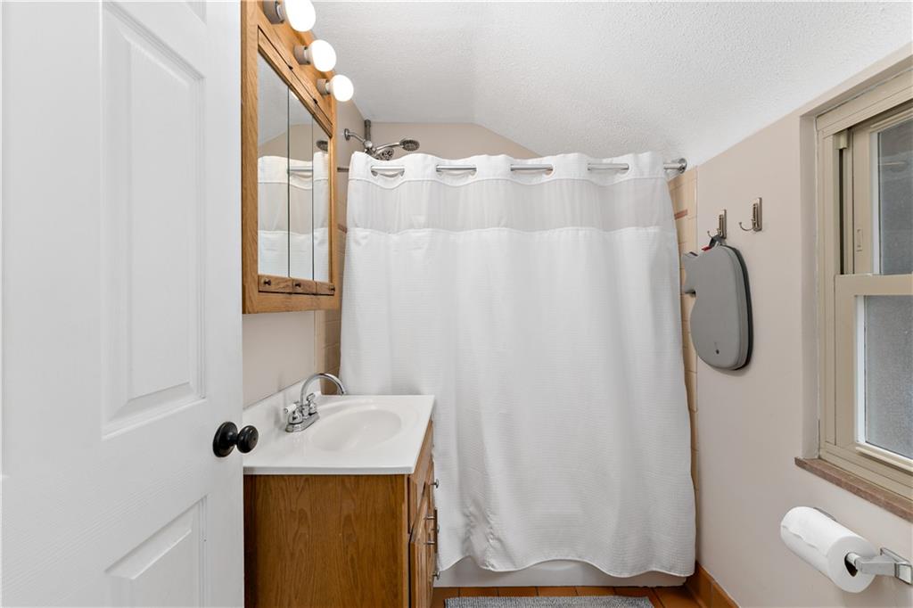 133 Cambridge Road Bethel Park, PA 15102 - Photo 21 of 43 a bathroom with a sink vanity and shower