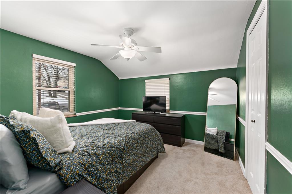 133 Cambridge Road Bethel Park, PA 15102 - Photo 22 of 43 a bedroom with a bed mirror and a window