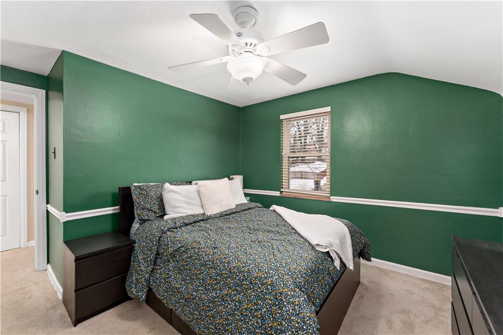 133 Cambridge Road Bethel Park, PA 15102 - Photo 23 of 43 a bedroom with a bed and a chandelier fan