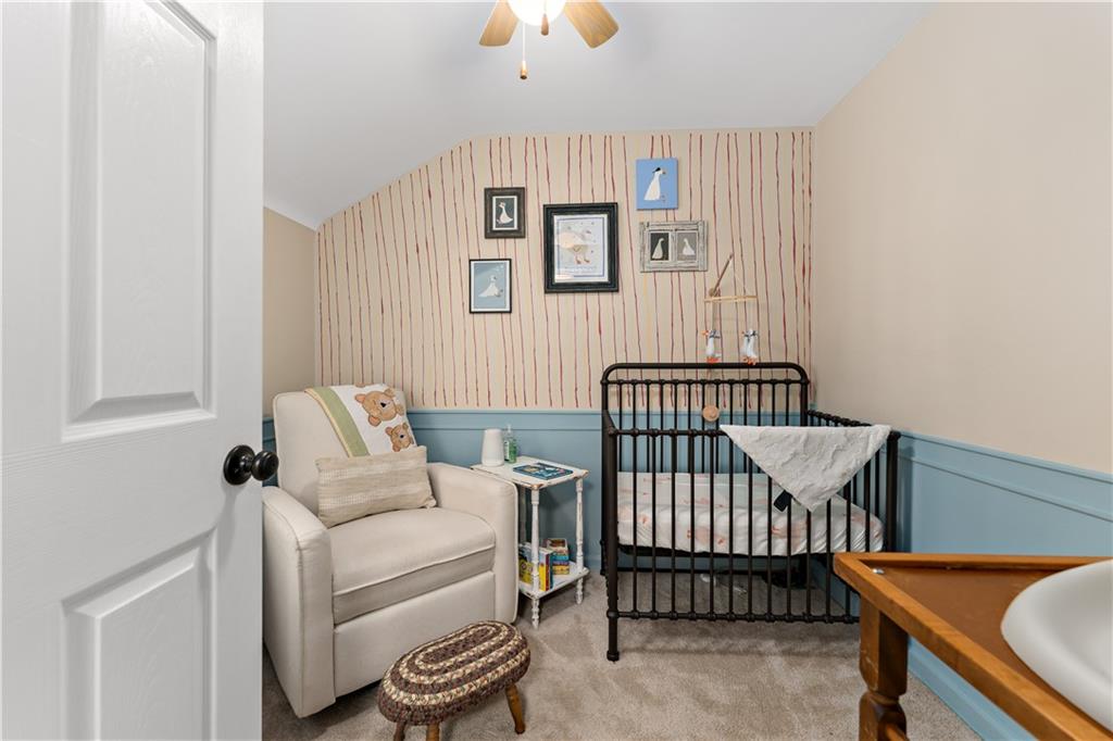 133 Cambridge Road Bethel Park, PA 15102 - Photo 25 of 43 a view of a bedroom with furniture and wooden floor