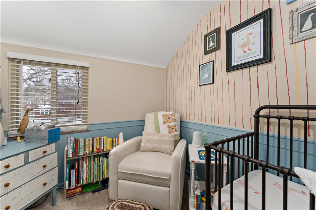 133 Cambridge Road Bethel Park, PA 15102 - Photo 26 of 43 a room with furniture a window and a book shelf