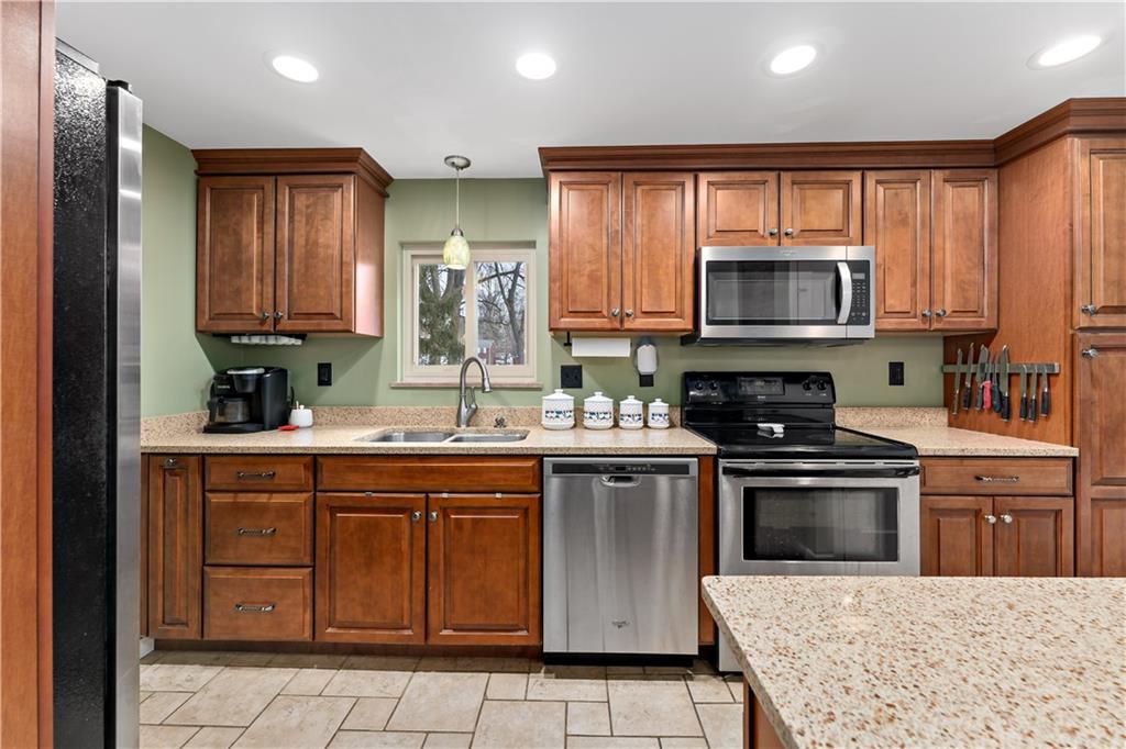 133 Cambridge Road Bethel Park, PA 15102 - Photo 3 of 43 a kitchen with a sink stove and microwave