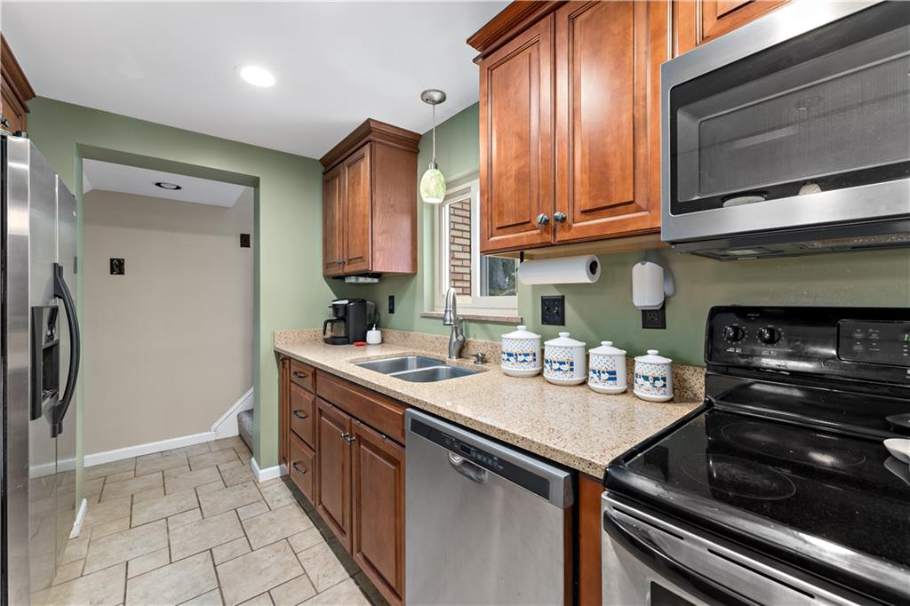 133 Cambridge Road Bethel Park, PA 15102 - Photo 4 of 43 a kitchen with a sink appliances and cabinets