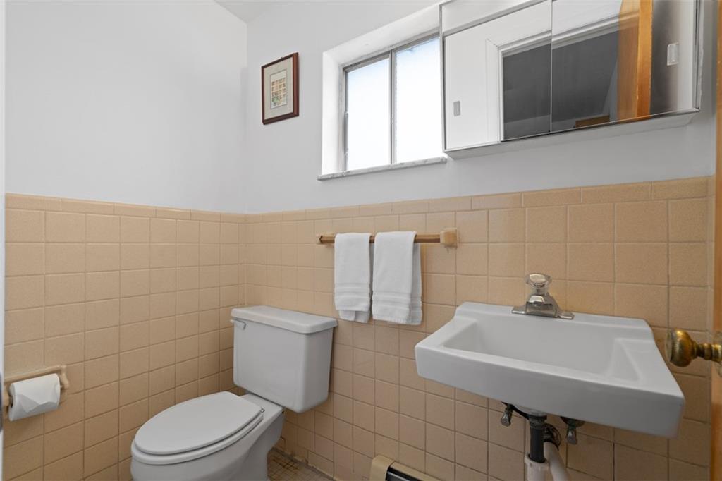 54 Price Road Presto, PA 15142 - Photo 15 of 46 a bathroom with a sink a toilet and mirror