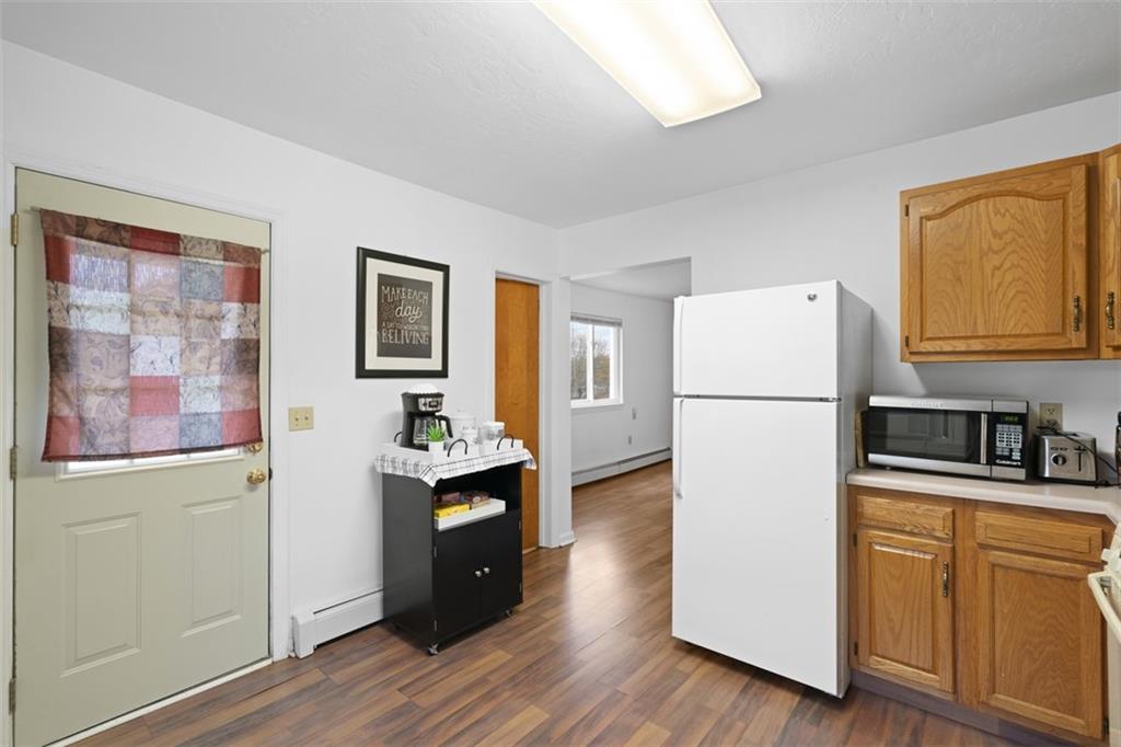 54 Price Road Presto, PA 15142 - Photo 17 of 46 a kitchen with a refrigerator and a stove