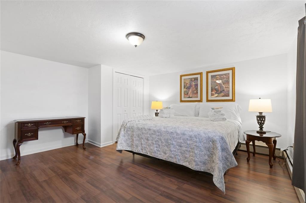 54 Price Road Presto, PA 15142 - Photo 19 of 46 a bedroom with a bed and a chair