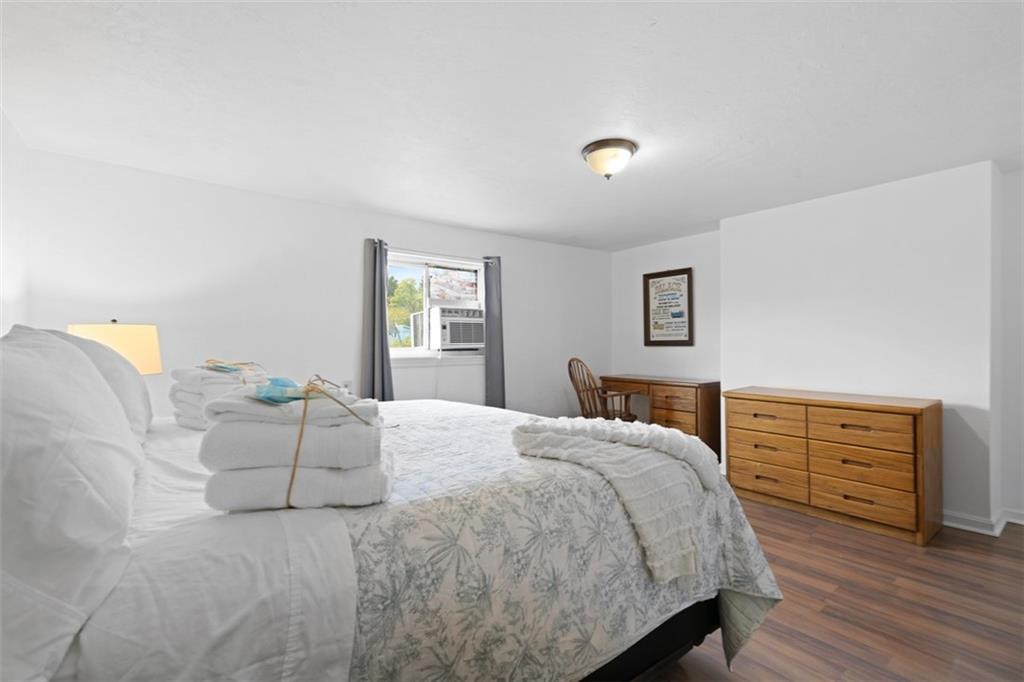 54 Price Road Presto, PA 15142 - Photo 20 of 46 a bedroom with a bed and wooden floor