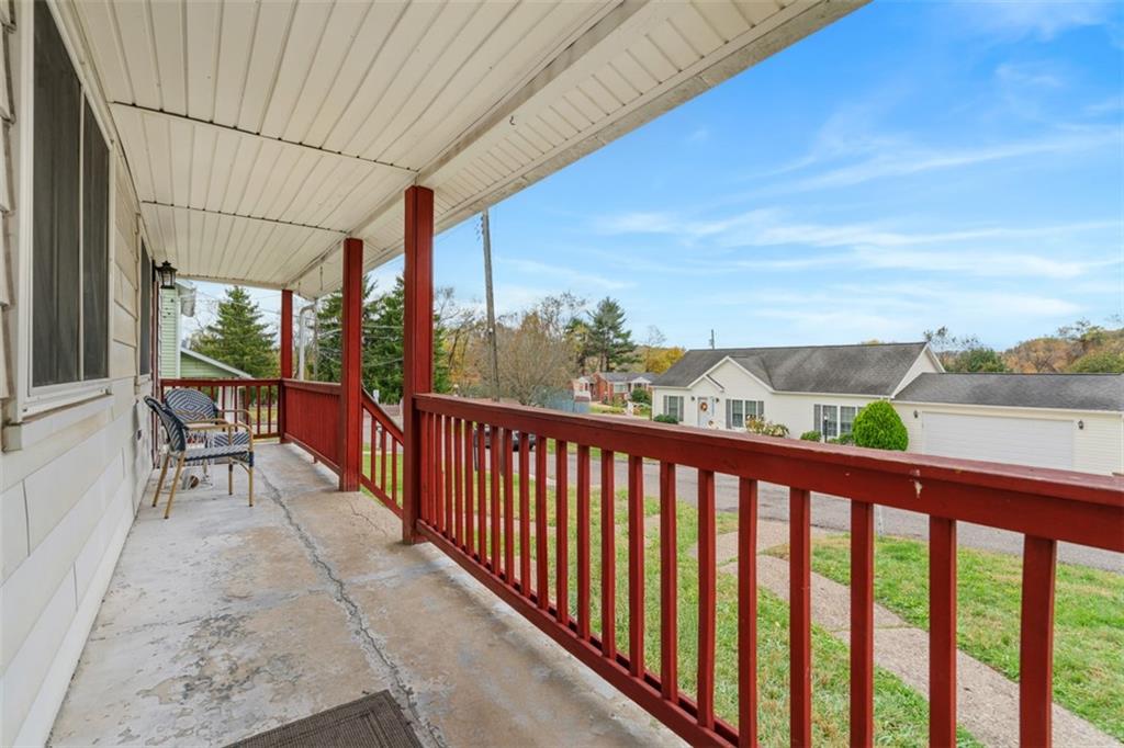 54 Price Road Presto, PA 15142 - Photo 6 of 46 a balcony with wooden floor outdoor seating and city view