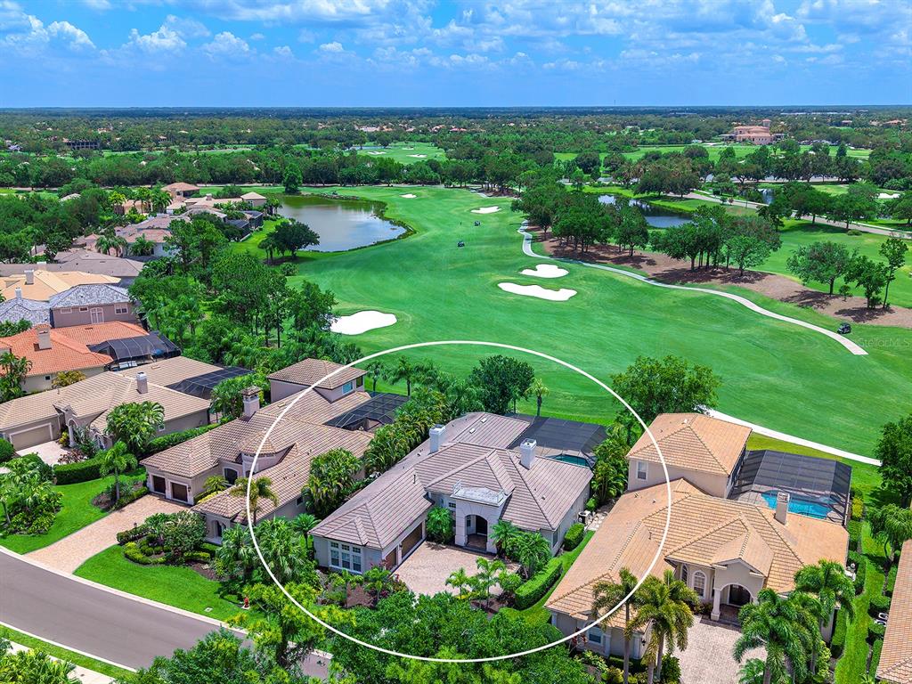 7431 Greystone Street Lakewood Ranch, FL 34202 - Photo 72 of 85 an aerial view of a house with garden space and street view