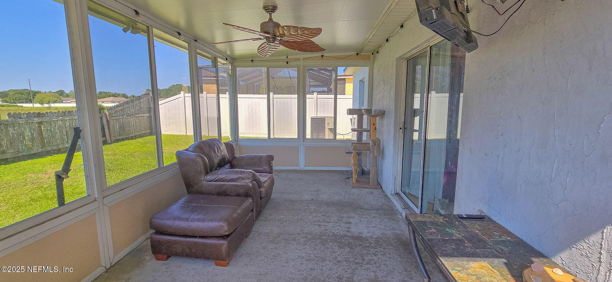 3228 Talisman Drive Middleburg, FL 32068 - Photo 20 of 29 a living room with furniture and a floor to ceiling window