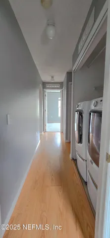a view of a livingroom with wooden floor