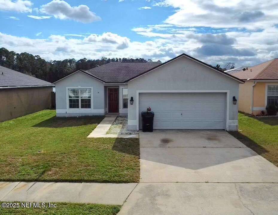 3228 Talisman Drive Middleburg, FL 32068 - Photo 26 of 29 front view of house with a yard